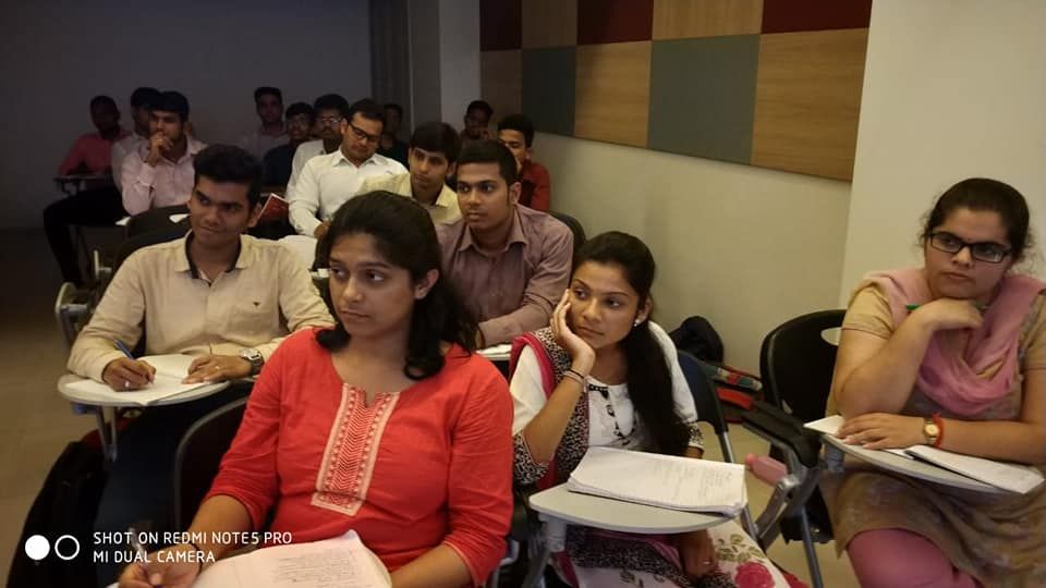 Participants listening closely in a classroom session